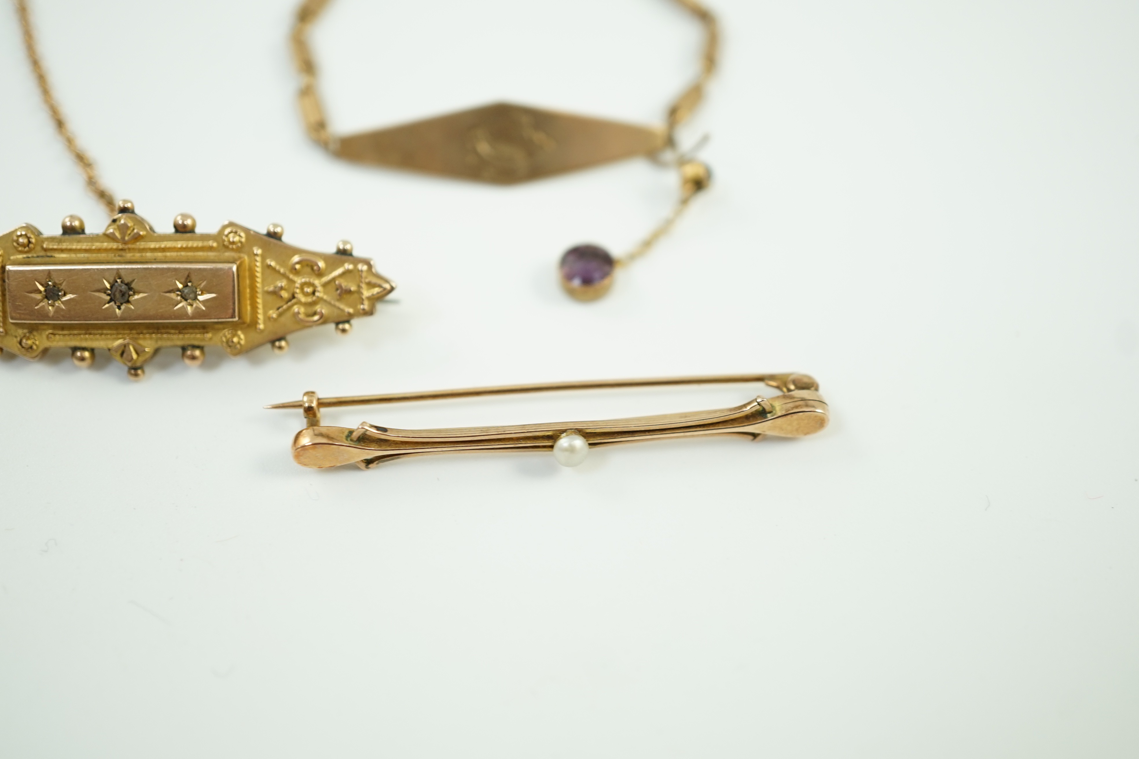 Two early 20th century yellow metal brooches including 9ct and diamond chip set and a seed pearl set bar brooch by Murrle Bennett & Co?, together with a 9ct identity bracelet, gross weight 10.6 grams.